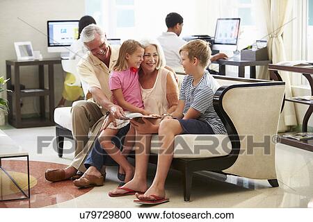 Grandparents With Grandchildren Sitting In Hotel Lobby View Large Photo Image Stock Image - Grandparents With Grandchildren Sitting In Hotel Lobby. Fotosearch