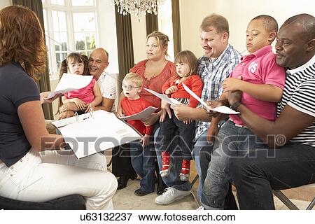 Stock Photo - Group meeting for Downs Syndrome families. Fotosearch