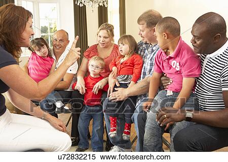 Stock Photography - Group meeting for Downs Syndrome families. Fotosearch