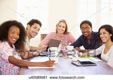 Group Of Business People Sitting Around Table In Meeting View Large Photo Image Stock Image - Group Of Business People Sitting Around Table In Meeting. Fotosearch