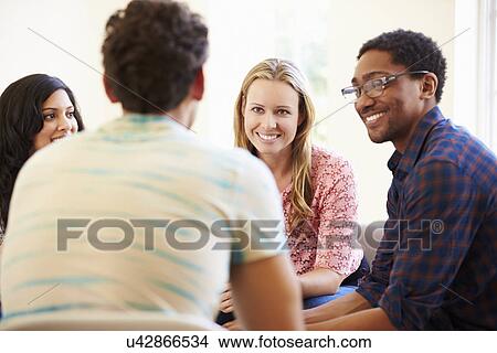 Picture - Group Of Business People Sitting On Chairs Having Meeting . Fotosearch