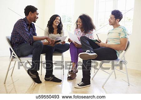 Group Of Business People Sitting On Chairs Having Meeting View Large Photo Image Stock Image - Group Of Business People Sitting On Chairs Having Meeting . Fotosearch