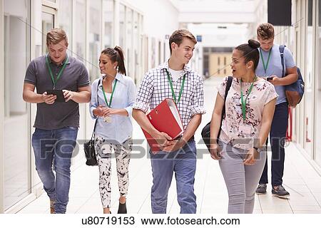 Group Of College Students Walking Along Corridor View Large Photo Image Stock Image - Group Of College Students Walking Along Corridor. Fotosearch