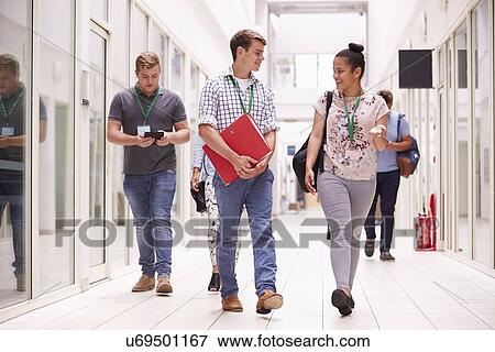 Group Of College Students Walking Along Corridor View Large Photo Image Stock Photo - Group Of College Students Walking Along Corridor. Fotosearch