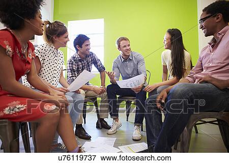 Group Of Designers Meeting To Discuss New Ideas View Large Photo Image Stock Photo - Group Of Designers Meeting To Discuss New Ideas. Fotosearch