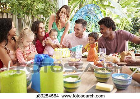 Group Of Families Celebrating Child's Birthday At Home View Large Photo Image Picture - Group Of Families Celebrating Child's Birthday At Home. Fotosearch