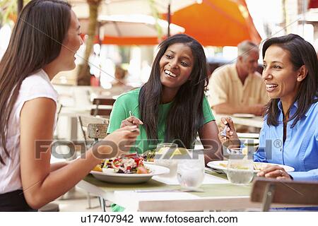 Group Of Female Friends Enjoying Lunch In Outdoor Restaurant View Large Photo Image Stock Image - Group Of Female Friends Enjoying Lunch In Outdoor Restaurant. Fotosearch