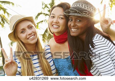 Group Of Female Friends Having Fun In Park Together View Large Photo Image Stock Photo - Group Of Female Friends Having Fun In Park Together. Fotosearch