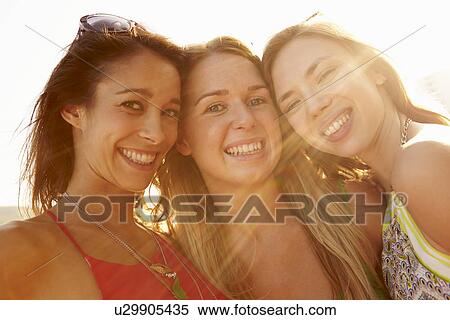 Group Of Female Friends On Summer Holiday Together View Large Photo Image Stock Photography - Group Of Female Friends On Summer Holiday Together . Fotosearch