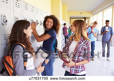 Group Of Female High School Students Talking By Lockers View Large Photo Image Stock Photo - Group Of Female High School Students Talking By Lockers. Fotosearch