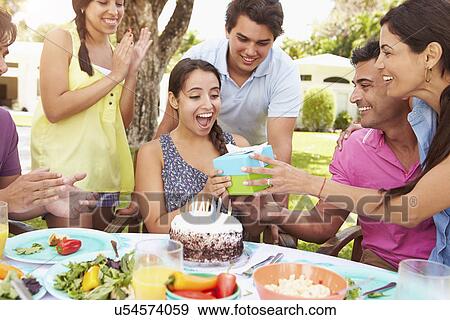 Group Of Friends Celebrating Birthday At Home View Large Photo Image Stock Photo - Group Of Friends Celebrating Birthday At Home. Fotosearch