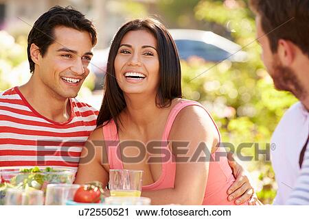 Group Of Friends Enjoying Meal At Outdoor Party In Back Yard View Large Photo Image Stock Image - Group Of Friends Enjoying Meal At Outdoor Party In Back Yard. Fotosearch