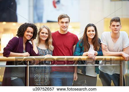 Group Of Friends Hanging Out In Shopping Mall View Large Photo Image Stock Photo - Group Of Friends Hanging Out In Shopping Mall . Fotosearch