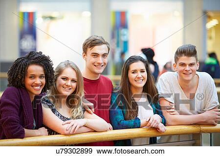 Stock Photo - Group Of Friends Hanging Out In Shopping Mall . Fotosearch