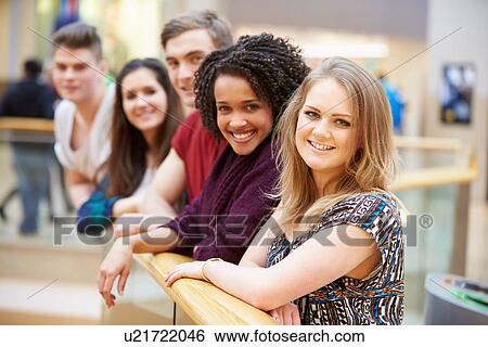 Stock Photograph - Group Of Friends Hanging Out In Shopping Mall . Fotosearch
