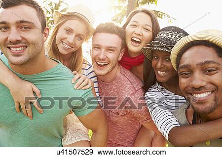 Group Of Friends Having Fun In Park Together View Large Photo Image Stock Photo - Group Of Friends Having Fun In Park Together. Fotosearch