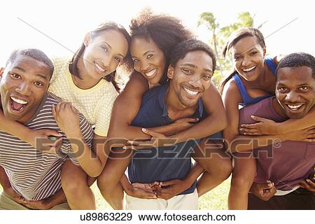 Group Of Friends Having Fun Outdoors View Large Photo Image Stock Photo - Group Of Friends Having Fun Outdoors. Fotosearch