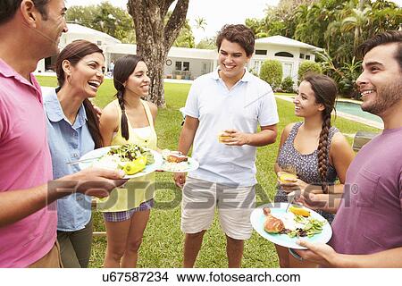 Group Of Friends Having Party In Backyard At Home View Large Photo Image Picture - Group Of Friends Having Party In Backyard At Home. Fotosearch