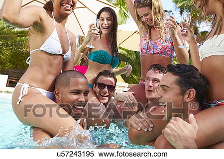 Group Of Friends Having Party In Pool Drinking Champagne View Large Photo Image Stock Photography - Group Of Friends Having Party In Pool Drinking Champagne. Fotosearch
