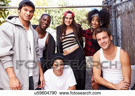 Group Of Friends In Urban Setting Standing By Fence View Large Photo Image Stock Image - Group Of Friends In Urban Setting Standing By Fence. Fotosearch