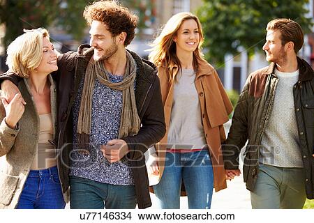 Group Of Friends Walking Through City Park Together View Large Photo Image Picture - Group Of Friends Walking Through City Park Together. Fotosearch