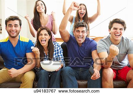 Stock Photo - Group of Friends Watching Soccer Celebrating Goal. Fotosearch