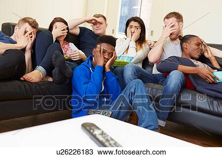 Group Of Friends Watching Television At Home Together View Large Photo Image Stock Image - Group Of Friends Watching Television At Home Together. Fotosearch