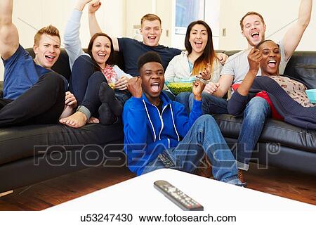 Group Of Friends Watching Television At Home Together View Large Photo Image Stock Image - Group Of Friends Watching Television At Home Together. Fotosearch