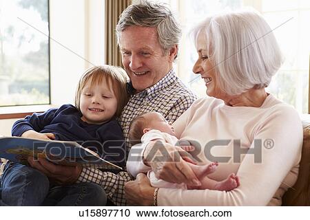 Stock Image - Group Of Friends Watching Television Together At Home. Fotosearch