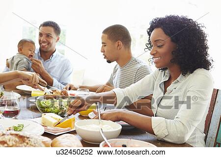 Group Of Friends With Babies Enjoying Meal At Home Together View Large Photo Image Stock Image - Group Of Friends With Babies Enjoying Meal At Home Together. Fotosearch