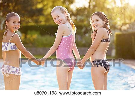 Stock Photo - Group Of Girls Playing In Outdoor Swimming Pool. Fotosearch