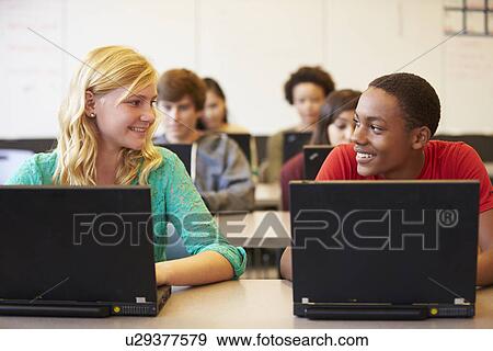 Stock Photo - Group Of High School Students In Class Using Laptops. Fotosearch