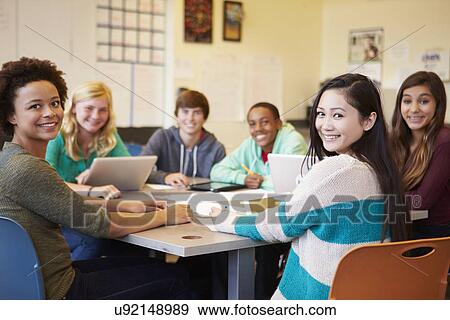 Stock Photo - Group Of High School Students In Class Using Laptops. Fotosearch