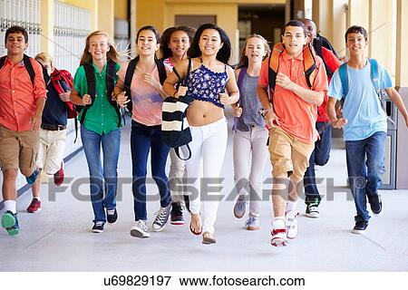 Stock Photo - Group Of High School Students Running Along Corridor. Fotosearch