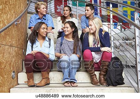 Group Of High School Students Sitting Outside Building View Large Photo Image Stock Photo - Group Of High School Students Sitting Outside Building. Fotosearch