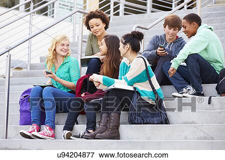 Group Of High School Students Sitting Outside Building View Large Photo Image Stock Photo - Group Of High School Students Sitting Outside Building. Fotosearch