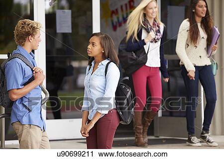 Stock Image - Group Of High School Students Standing Outside Building. Fotosearch