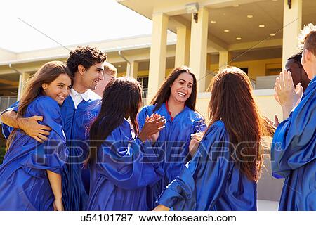 Stock Photo - Group Of High School Students Celebrating Graduation. Fotosearch