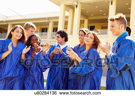 Stock Photograph - Group Of High School Students Celebrating Graduation. Fotosearch