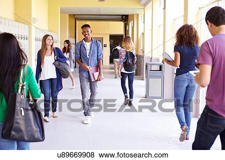 Group Of High School Students Walking Along Hallway View Large Photo Image Stock Photo - Group Of High School Students Walking Along Hallway. Fotosearch