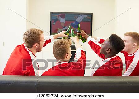 Picture - Group Of Sports Fans Watching Game On TV At Home. Fotosearch