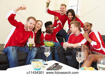 Group Of Sports Fans Watching Game On TV At Home View Large Photo Image Stock Image - Group Of Sports Fans Watching Game On TV At Home. Fotosearch