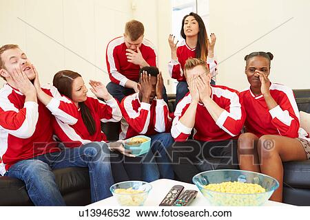 Group Of Sports Fans Watching Game On TV At Home View Large Photo Image Stock Image - Group Of Sports Fans Watching Game On TV At Home. Fotosearch