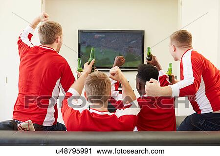 Stock Image - Group Of Sports Fans Watching Game On TV At Home. Fotosearch