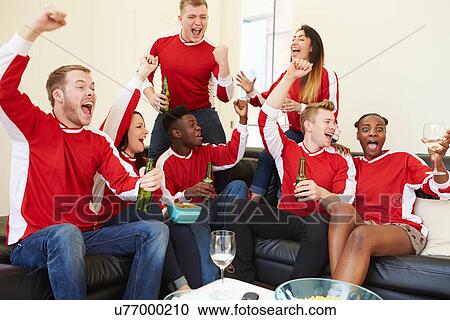 Group Of Sports Fans Watching Game On TV At Home View Large Photo Image Stock Image - Group Of Sports Fans Watching Game On TV At Home. Fotosearch