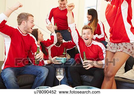 Group Of Sports Fans Watching Game On TV At Home View Large Photo Image Stock Image - Group Of Sports Fans Watching Game On TV At Home. Fotosearch