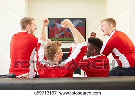 Stock Photo - Group Of Sports Fans Watching Game On TV At Home. Fotosearch