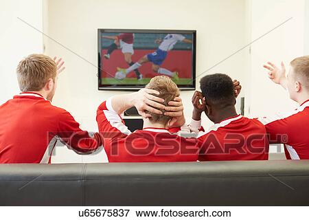 Group Of Sports Fans Watching Game On TV At Home View Large Photo Image Stock Photo - Group Of Sports Fans Watching Game On TV At Home. Fotosearch