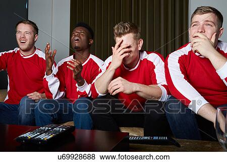 Group Of Sports Fans Watching Game On TV At Home View Large Photo Image Stock Photo - Group Of Sports Fans Watching Game On TV At Home. Fotosearch