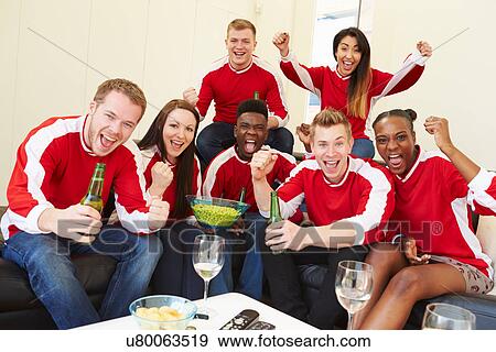 Group Of Sports Fans Watching Game On TV At Home View Large Photo Image Stock Photo - Group Of Sports Fans Watching Game On TV At Home. Fotosearch